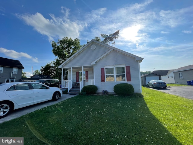 103 N W St, Harrington, DE 19952 - view of front of house featuring a porch and a front yard