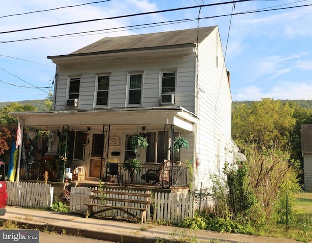 356-358 Oakland Ave, Ashland, PA 17921 - view of front of home with covered porch, a fenced front yard, and cooling unit