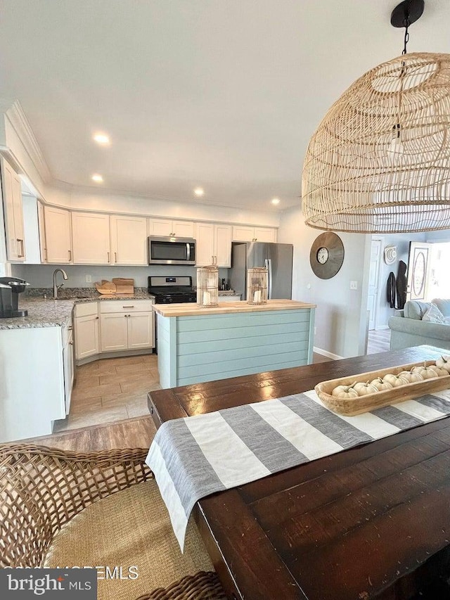 813 Forepeak Dr, Forked River, NJ 08731 - kitchen with stainless steel appliances, white cabinetry, recessed lighting, light wood-type flooring, and a center island