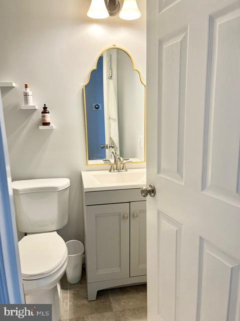 813 Forepeak Dr, Forked River, NJ 08731 - half bathroom with vanity and tile patterned flooring