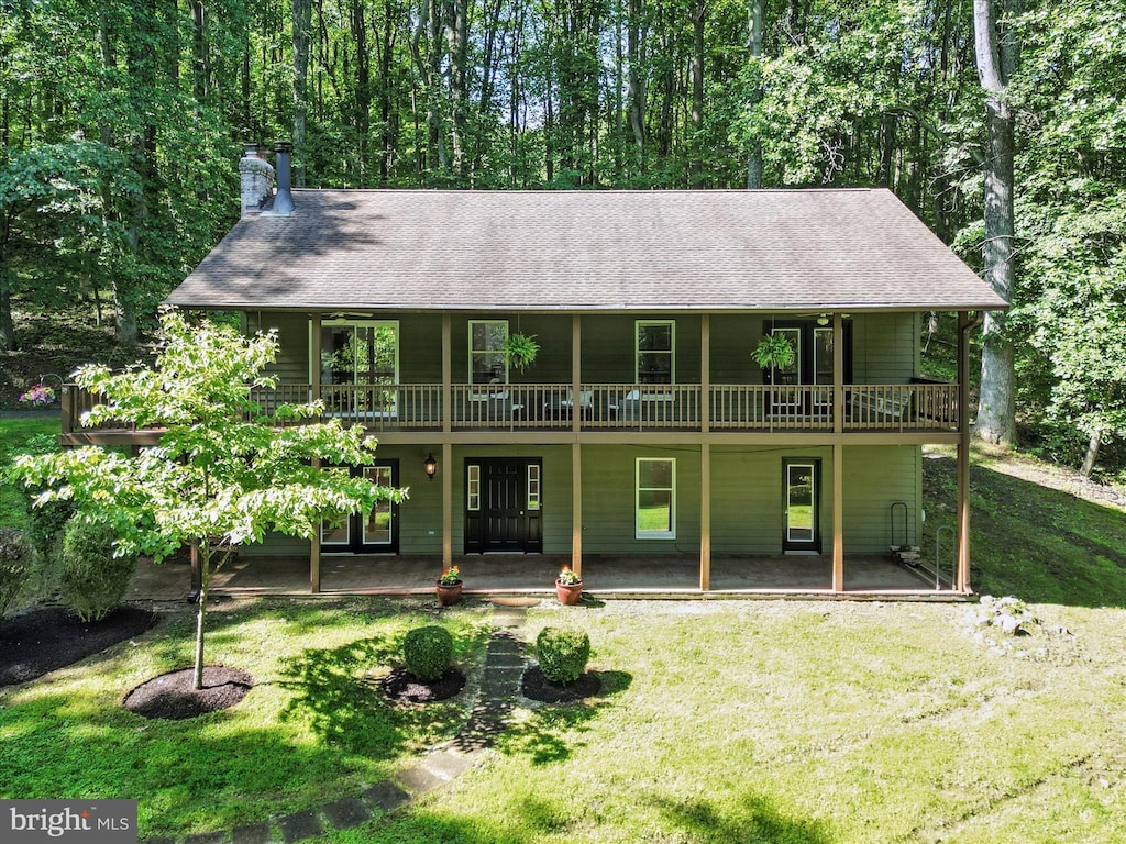 181 High Knob Ct, Front Royal, VA 22630 - view of front of house with a front lawn, a patio, a chimney, and roof with shingles