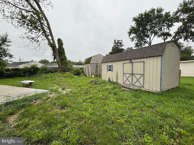 14503 Melbourne Ave, Woodbridge, VA 22191 - view of green lawn featuring a storage unit