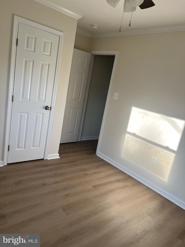 14503 Melbourne Ave, Woodbridge, VA 22191 - unfurnished bedroom with crown molding, light wood-type flooring, and a ceiling fan