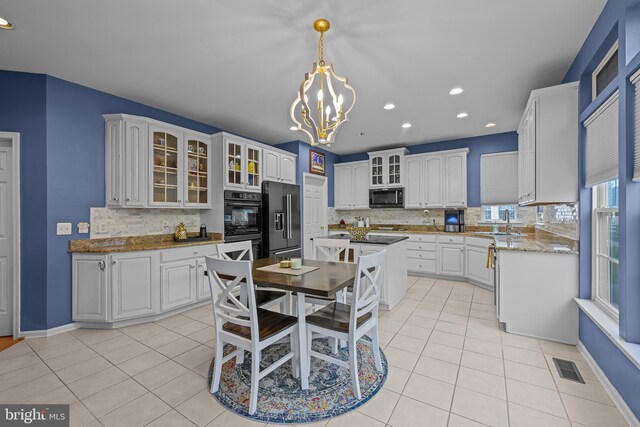 734 Wood Duck Ct, Middletown, DE 19709 - kitchen with high end refrigerator, a chandelier, backsplash, light tile patterned flooring, and recessed lighting