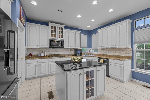 734 Wood Duck Ct, Middletown, DE 19709 - kitchen with stainless steel appliances, white cabinetry, light tile patterned floors, decorative backsplash, and recessed lighting