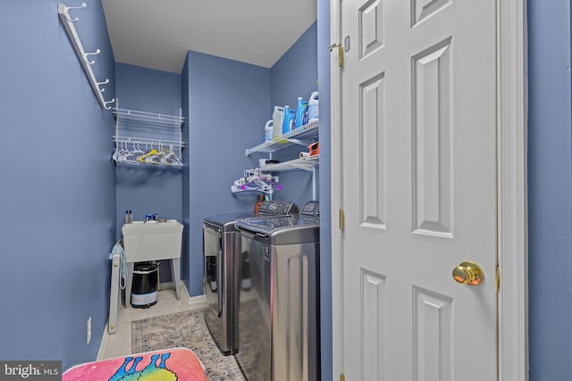 734 Wood Duck Ct, Middletown, DE 19709 - washroom featuring washing machine and clothes dryer and tile patterned floors