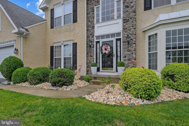 734 Wood Duck Ct, Middletown, DE 19709 - view of exterior entry featuring stucco siding and stone siding