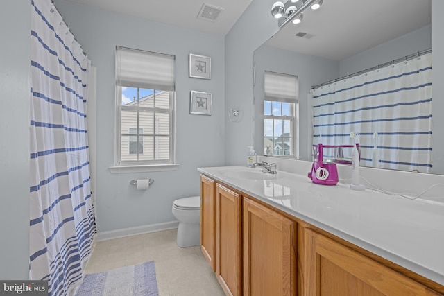 734 Wood Duck Ct, Middletown, DE 19709 - bathroom featuring vanity, plenty of natural light, tile patterned flooring, and curtained shower