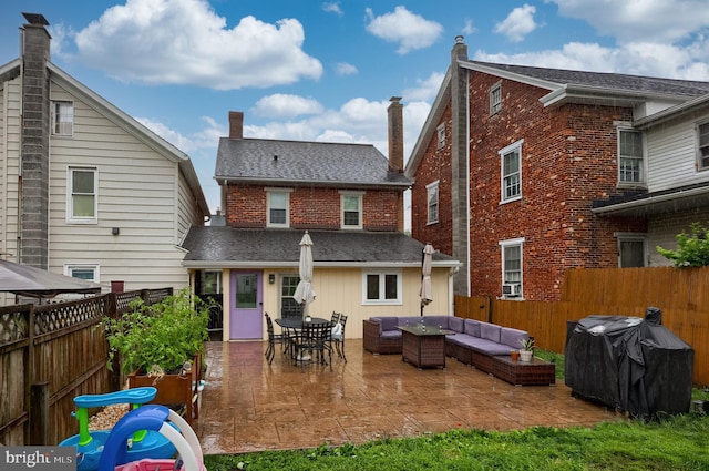 246 Marietta Ave, Mount Joy, PA 17552 - back of property featuring outdoor lounge area, a patio, brick siding, and a fenced backyard
