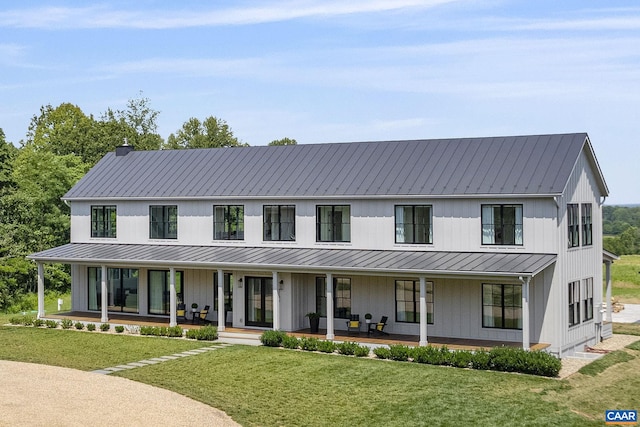 310 Goodloe Ln, Afton, VA 22920 - modern farmhouse style home with a standing seam roof, a metal roof, covered porch, a front lawn, and board and batten siding