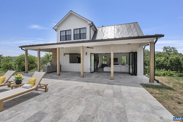 310 Goodloe Ln, Afton, VA 22920 - view of front facade with a patio, a ceiling fan, board and batten siding, a metal roof, and a standing seam roof