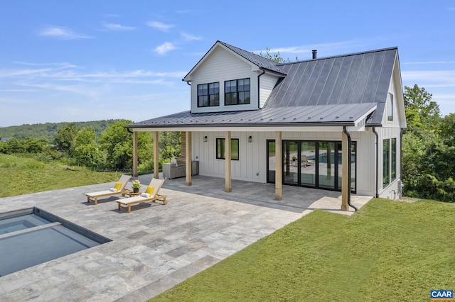 310 Goodloe Ln, Afton, VA 22920 - rear view of property featuring a patio area, a yard, board and batten siding, and a standing seam roof