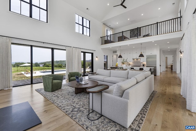 310 Goodloe Ln, Afton, VA 22920 - living room with a high ceiling, light wood-style flooring, and recessed lighting