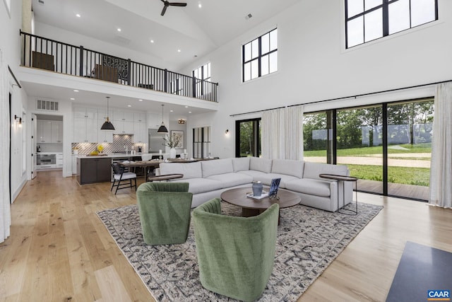 310 Goodloe Ln, Afton, VA 22920 - living room with high vaulted ceiling, a ceiling fan, light wood-style floors, and recessed lighting