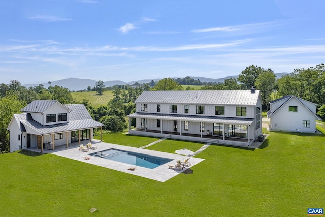 310 Goodloe Ln, Afton, VA 22920 - back of property with a standing seam roof, a metal roof, a lawn, and a mountain view