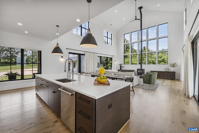 310 Goodloe Ln, Afton, VA 22920 - kitchen with dishwasher, high vaulted ceiling, light wood-style floors, light countertops, and open floor plan