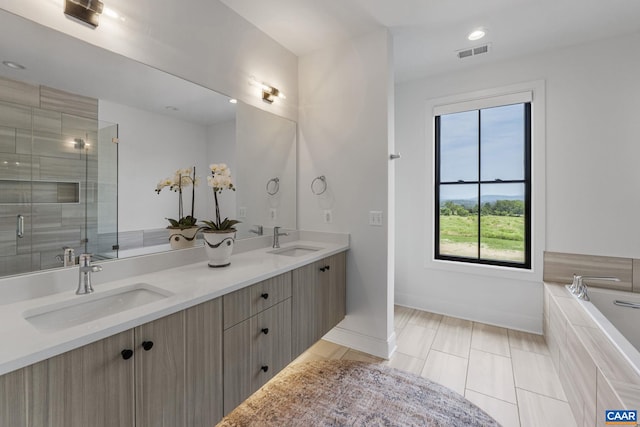 310 Goodloe Ln, Afton, VA 22920 - full bath featuring double vanity, a bath, a shower stall, and recessed lighting