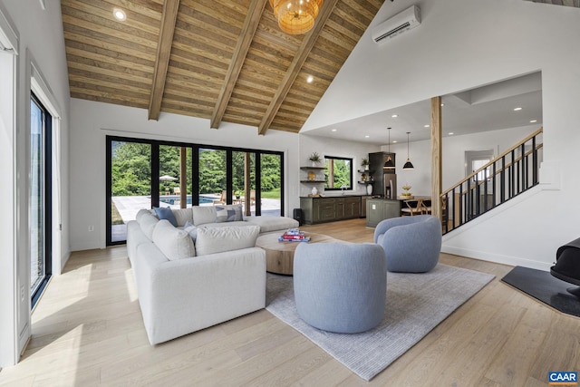 310 Goodloe Ln, Afton, VA 22920 - living area with a wooden ceiling with exposed beams, high vaulted ceiling, stairs, plenty of natural light, and light wood-type flooring
