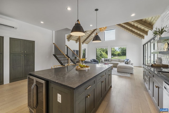 310 Goodloe Ln, Afton, VA 22920 - kitchen with beverage cooler, a wall mounted air conditioner, light wood finished floors, a center island, and recessed lighting