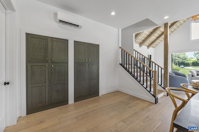 310 Goodloe Ln, Afton, VA 22920 - foyer with a wall mounted AC, light wood-style flooring, stairway, and recessed lighting
