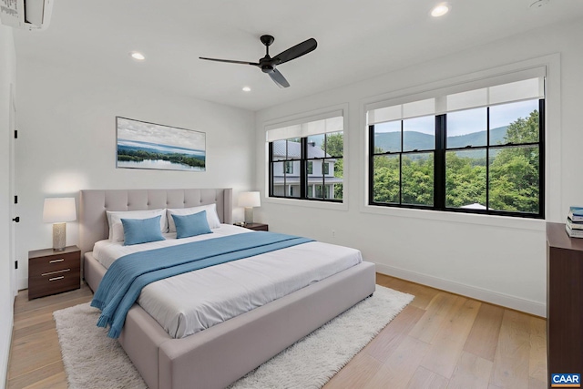 310 Goodloe Ln, Afton, VA 22920 - bedroom with multiple windows, light wood-type flooring, recessed lighting, and a mountain view