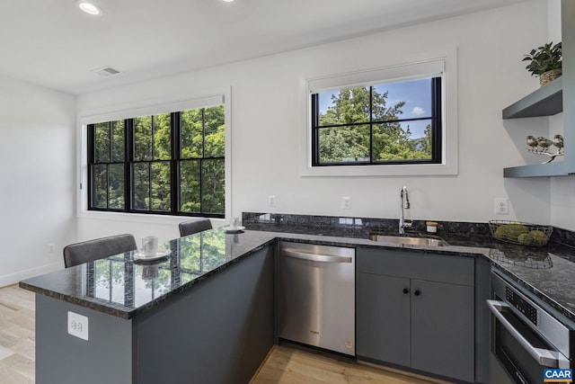 310 Goodloe Ln, Afton, VA 22920 - kitchen featuring stainless steel appliances, a peninsula, healthy amount of natural light, dark stone countertops, and recessed lighting