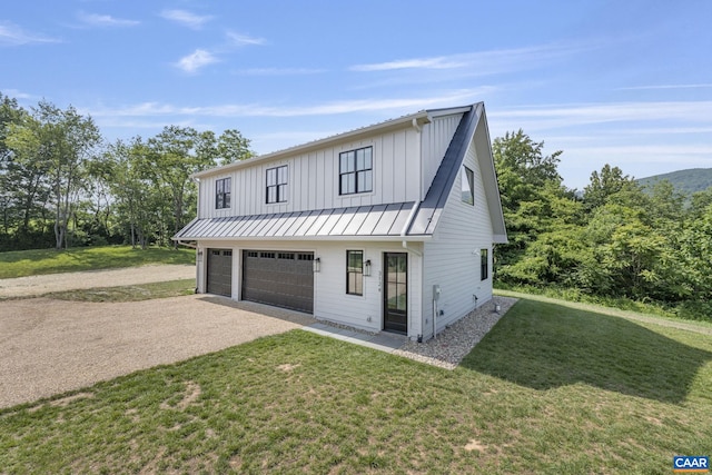 310 Goodloe Ln, Afton, VA 22920 - modern inspired farmhouse featuring driveway, an attached garage, a standing seam roof, a front lawn, and a metal roof