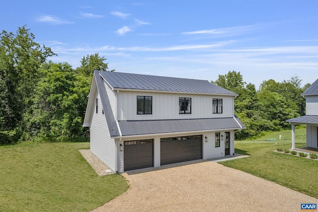 310 Goodloe Ln, Afton, VA 22920 - modern farmhouse with driveway, a front yard, board and batten siding, an attached garage, and a metal roof