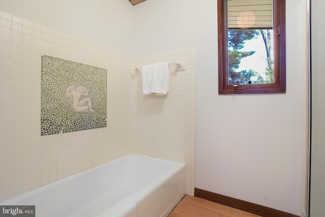 709 Springloch Rd, Silver Spring, MD 20904 - bathroom featuring wood finished floors and bathing tub / shower combination