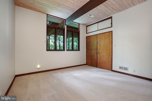709 Springloch Rd, Silver Spring, MD 20904 - unfurnished bedroom with carpet flooring, a wood ceiling with exposed beams, and a closet