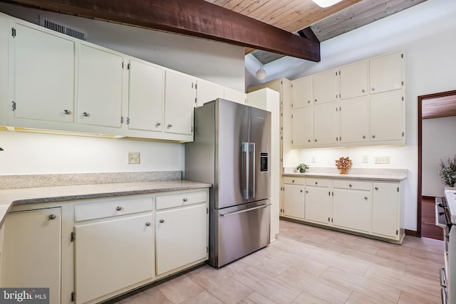 709 Springloch Rd, Silver Spring, MD 20904 - kitchen featuring stainless steel fridge, light countertops, a wooden ceiling with exposed beams, and white cabinetry