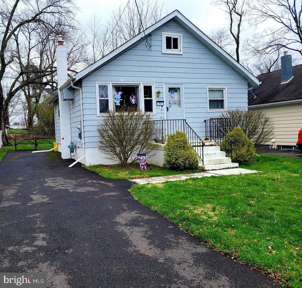 17 Hillman, Trenton, NJ 08638 - bungalow-style house with a chimney, a front lawn, and driveway