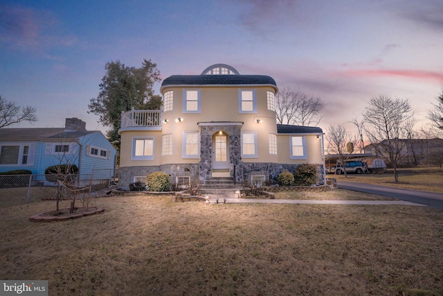34 Harvard Rd, Hagerstown, MD 21742 - view of front of house with stone siding, a balcony, and stucco siding