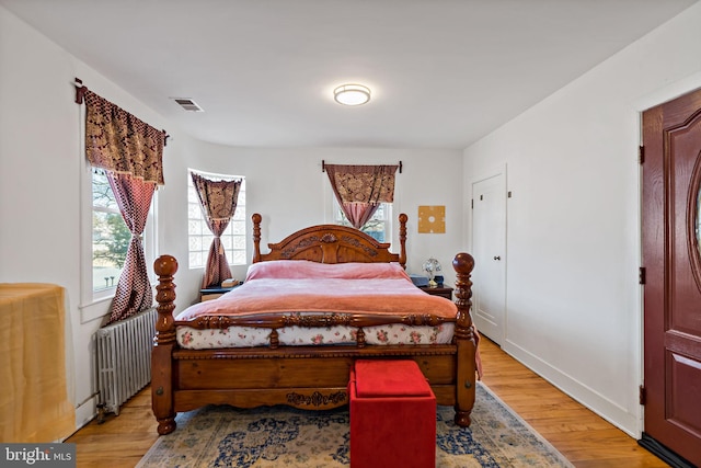 34 Harvard Rd, Hagerstown, MD 21742 - bedroom featuring radiator, multiple windows, and light wood-type flooring