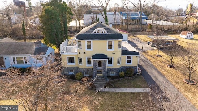 34 Harvard Rd, Hagerstown, MD 21742 - view of front of property with stone siding, stucco siding, and a balcony