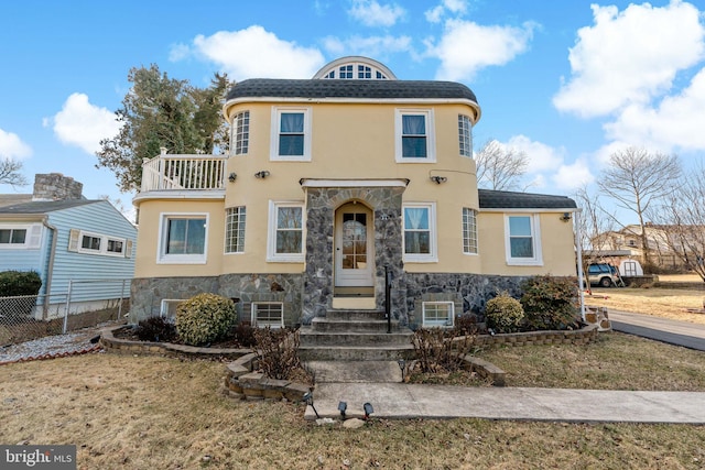 34 Harvard Rd, Hagerstown, MD 21742 - view of front of property with stone siding, a balcony, and stucco siding