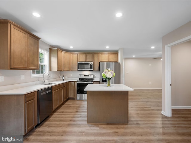 564 Great Oak Ct, Woodstock, VA 22664 - kitchen featuring stainless steel appliances, a center island, light wood finished floors, recessed lighting, and light countertops
