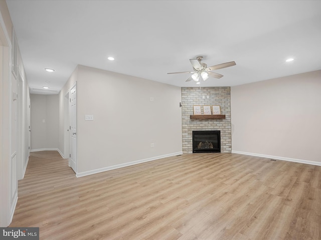 564 Great Oak Ct, Woodstock, VA 22664 - unfurnished living room featuring a ceiling fan, light wood-type flooring, recessed lighting, and a brick fireplace