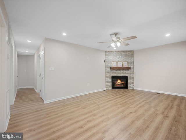564 Great Oak Ct, Woodstock, VA 22664 - unfurnished living room with a ceiling fan, light wood-type flooring, recessed lighting, and a brick fireplace