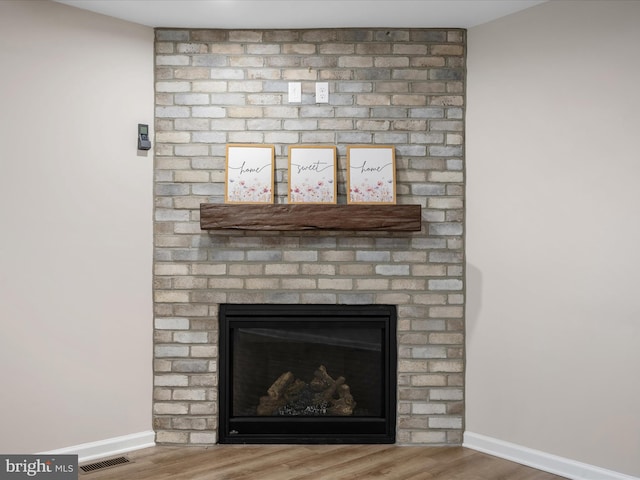 564 Great Oak Ct, Woodstock, VA 22664 - detailed view of wood finished floors and a brick fireplace