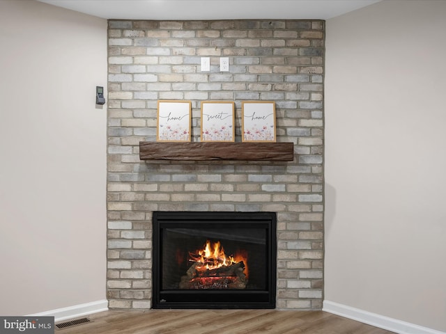 564 Great Oak Ct, Woodstock, VA 22664 - detailed view of wood finished floors and a brick fireplace