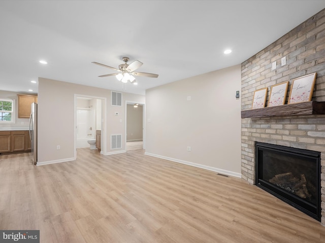 564 Great Oak Ct, Woodstock, VA 22664 - unfurnished living room with light wood-type flooring, a ceiling fan, a fireplace, and recessed lighting