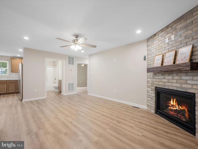 564 Great Oak Ct, Woodstock, VA 22664 - unfurnished living room with light wood-style flooring, a fireplace, ceiling fan, and recessed lighting