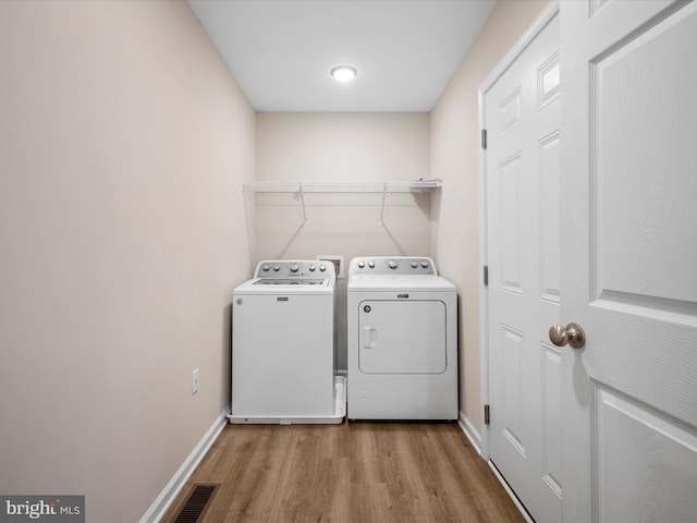 564 Great Oak Ct, Woodstock, VA 22664 - laundry area featuring separate washer and dryer and light wood-style floors