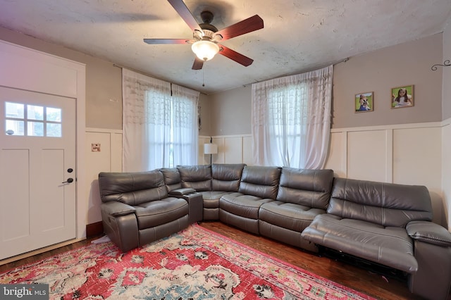 305 N Market St, Elizabethtown, PA 17022 - living room featuring wainscoting, ceiling fan, wood finished floors, and a decorative wall