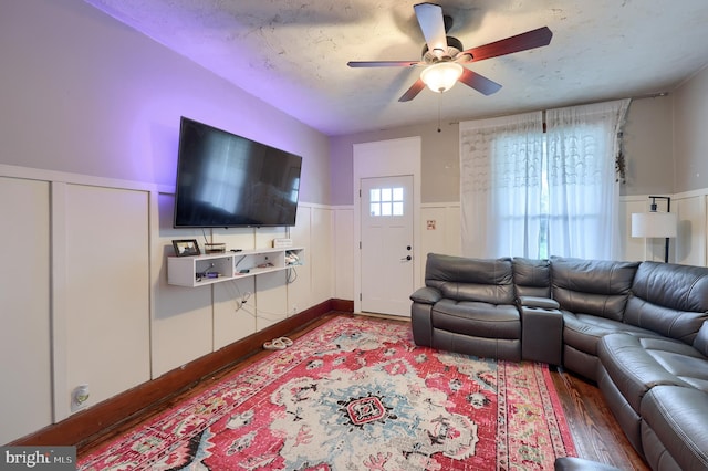 305 N Market St, Elizabethtown, PA 17022 - living area featuring ceiling fan, a wainscoted wall, and a decorative wall