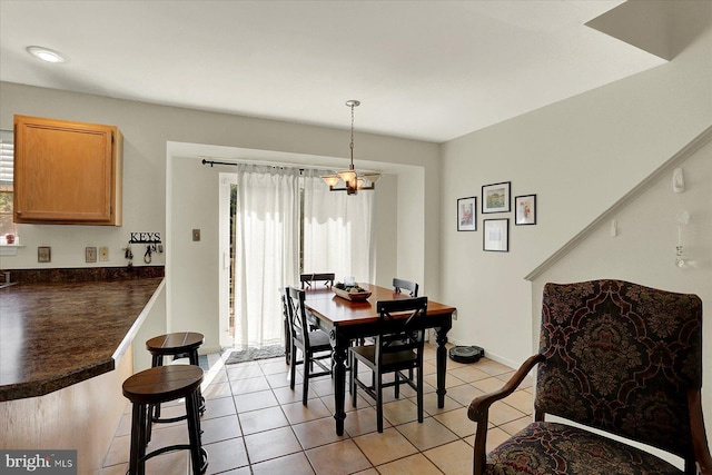 309 Lincoln Ave, Harrisburg, PA 17111 - dining room with a chandelier and light tile patterned floors