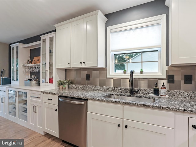 443 Executive Way, Hedgesville, WV 25427 - kitchen with dishwasher, light stone countertops, white cabinetry, backsplash, and light wood-style floors