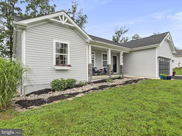 443 Executive Way, Hedgesville, WV 25427 - view of front of home with a garage, covered porch, a front yard, and roof with shingles