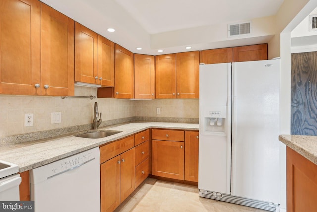 10306 Valley Forge Cir Unit 306, King Of Prussia, PA 19406 - kitchen with white appliances, recessed lighting, brown cabinetry, and backsplash